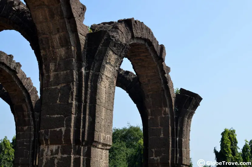 The standing arches of the Bara Kamam is one of the iconic historical places to visit in Bijapur.