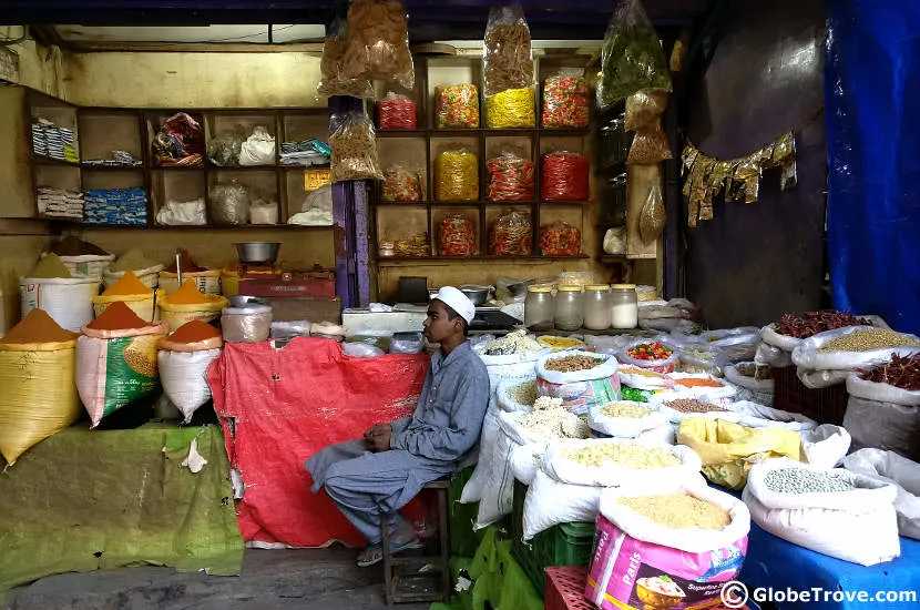 A young boy seated in a local grocery store.