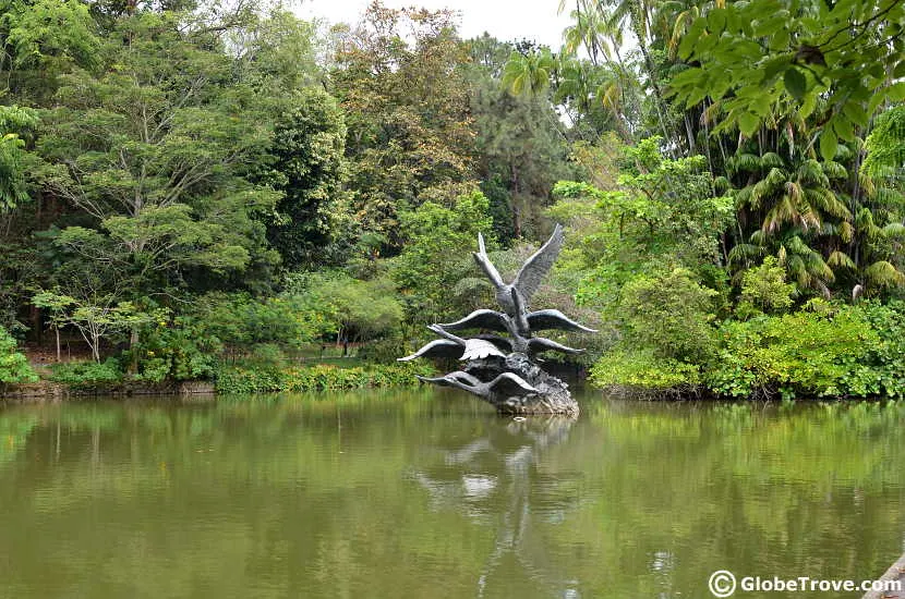 The statue in the centre of swan lake in the Singapore Botanic Gardens.