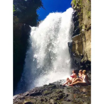 Lounging by Tegenungan waterfall in Bali.