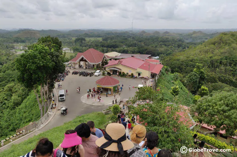 A view from the top of the observation point in the chocolate hills which shows the crowds heading both up and down.