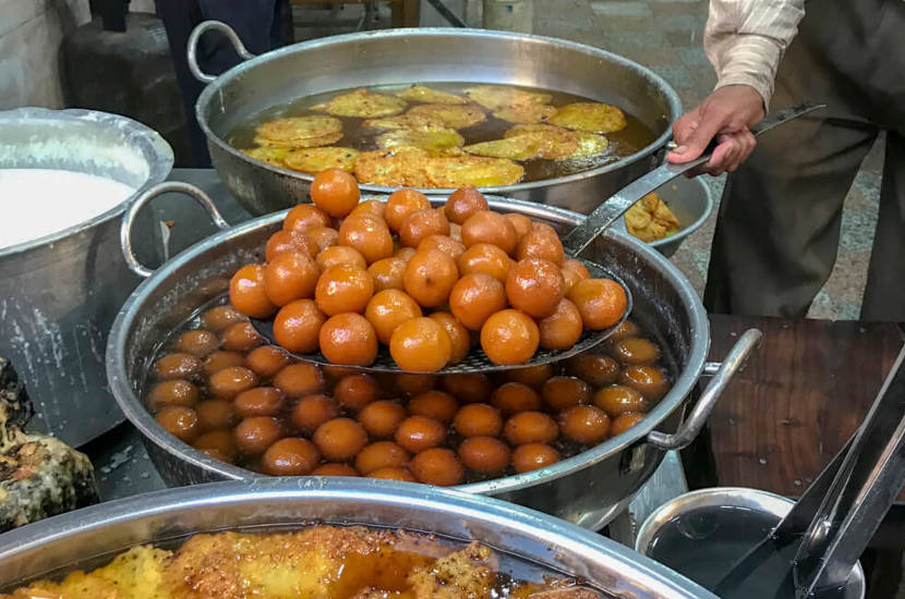 If you love sweets then gulab jamuns are an item of Indian street food that you should try.