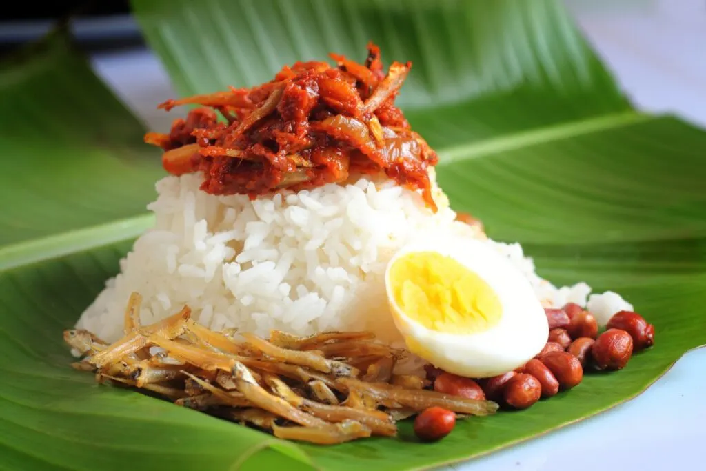 Nasi Lemak is a flavor packed dish that is popular as street food in Penang.