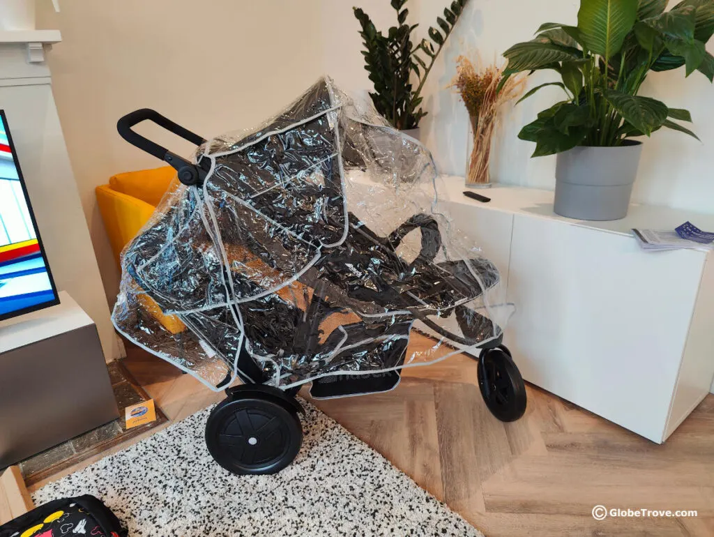 You can see how the rain cover covers the entire double stroller.