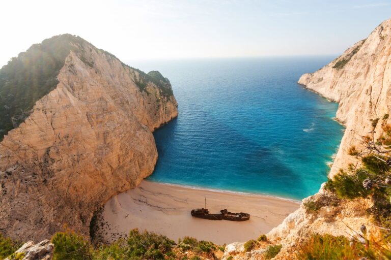 The limestone cliffs and the blue water makes the cheap islands in Greece so tempting.