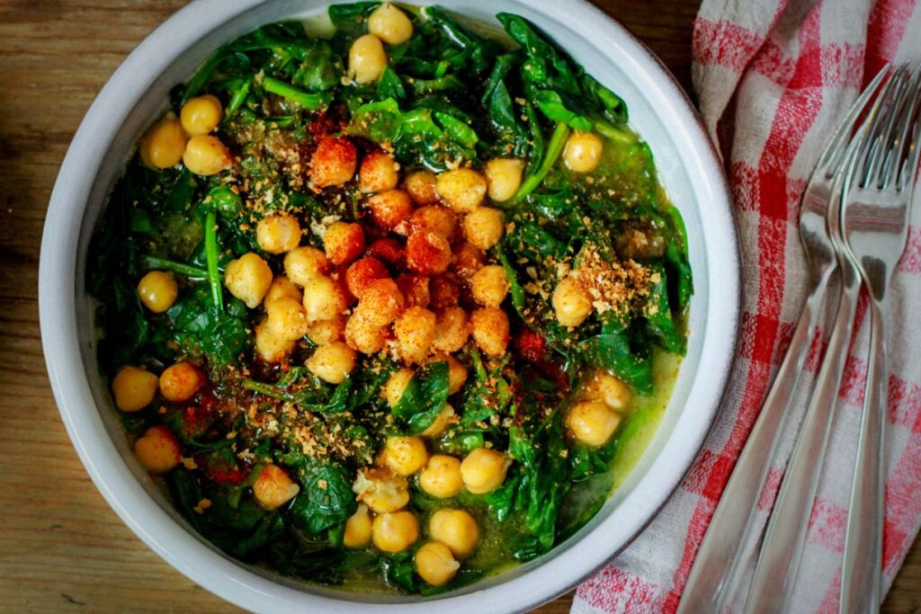 Spinach and chickpeas in a bowl are one of the best tapas in Andalucia.