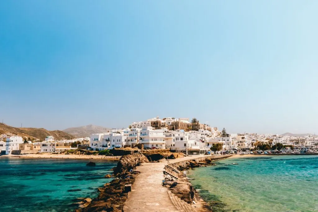 A gorgeous pathway leading to Naxos with a beach on either side. It is one of the best cheap islands in Greece.