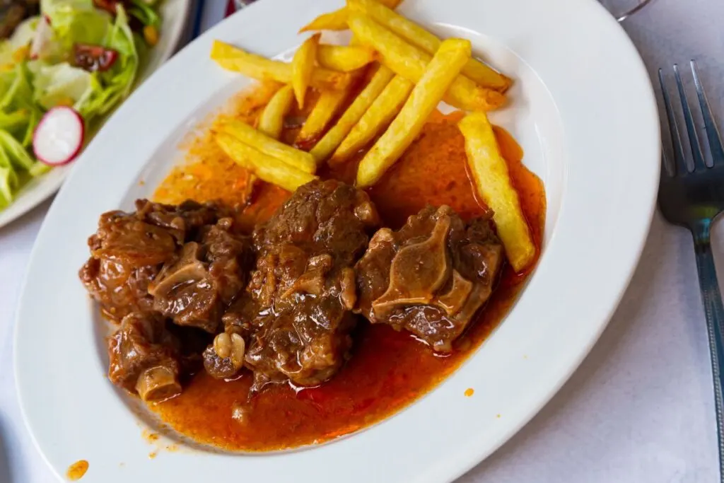 Pieces of oxtail soup served with potato fries is a delicacy when it comes to tapas in Andalucia.