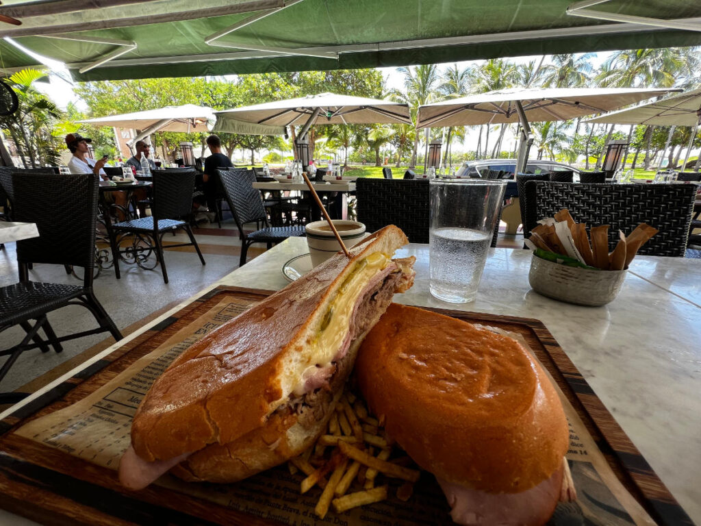 A cuban sandwich which is cut in half and has melted cheese. Definitely a lunch you will enjoy during your 3 days in Miami.