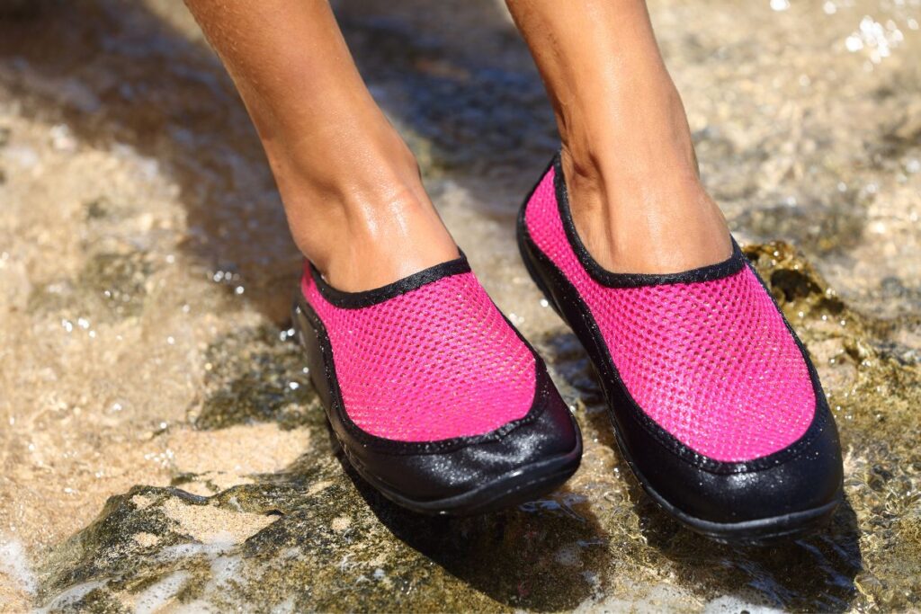 Pink and black water shoes which are perfect if you are packing for Italy in summer.