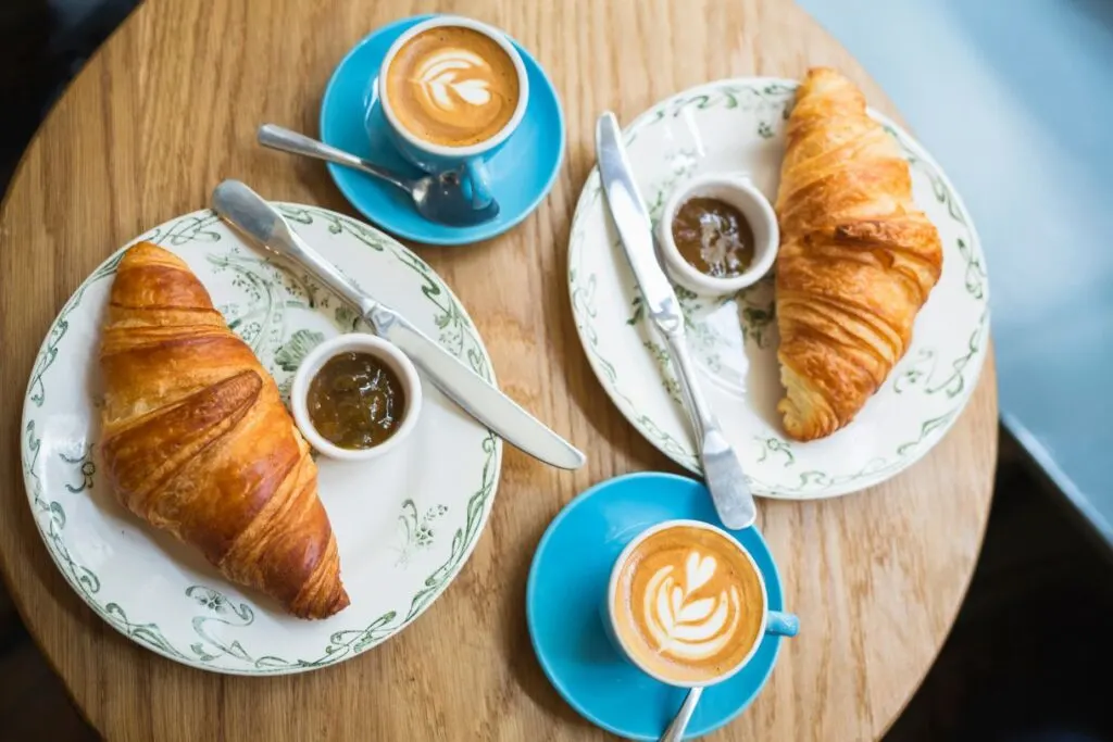 Croissants and coffee on a table served up as breakfast at Palacio Solecio which is one of the best luxury hotels in Malaga