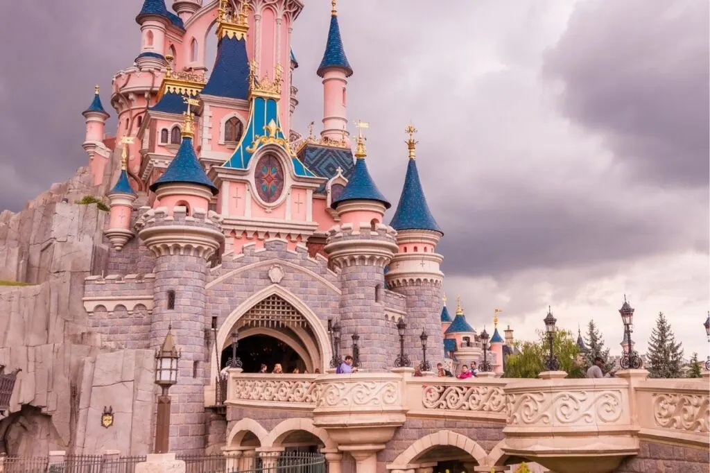 Visiting the pink and blue castle in Disneyland Paris is one of the coolest Paris gifts