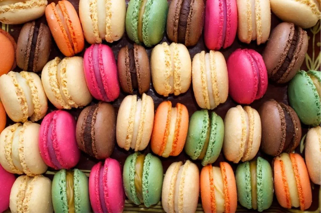 Different colored macaroons with fillings arranged in rows are definitely one of the best Paris gifts.