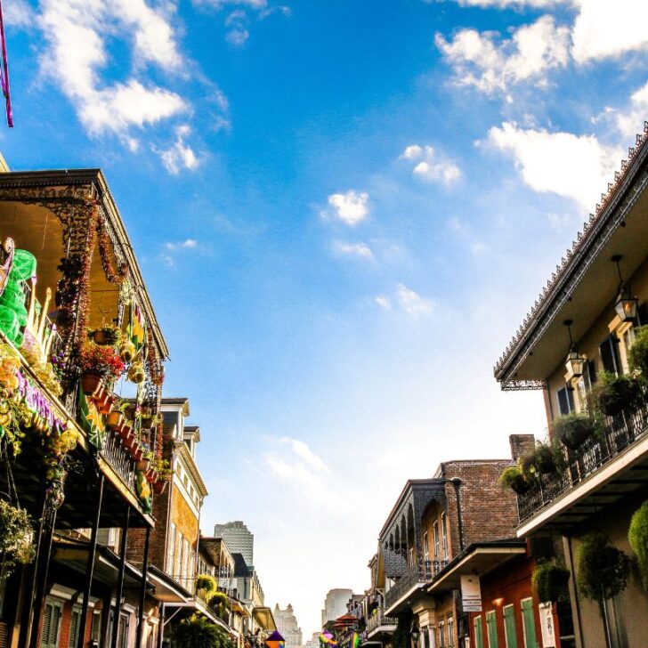 The buildings in New Orleans decked up for Mardi Gras. A lot of the New Orleans captions and quotes are about this festival.