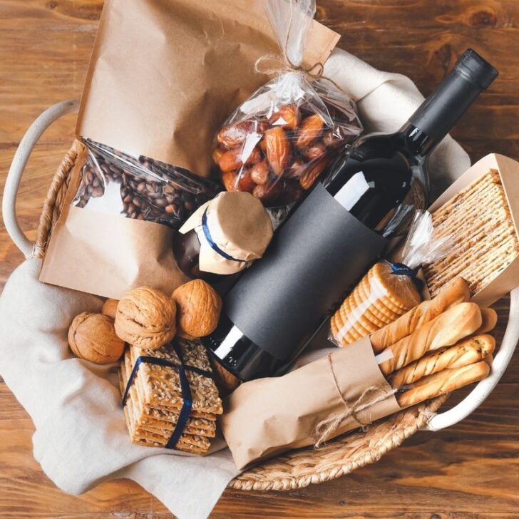 A basket with wine, baguettes, coffee beans and more. All of which make great Paris gifts
