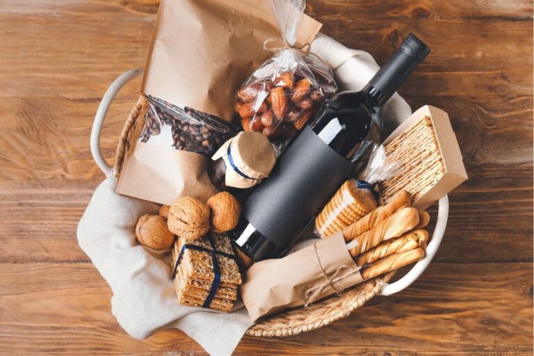 A basket with wine, baguettes, coffee beans and more. All of which make great Paris gifts