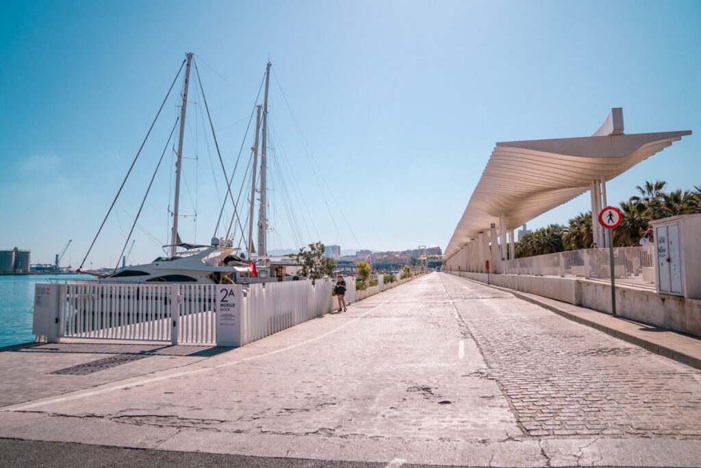 Ships docked at Malagas harbor near muelle uno which is close to Ilunion Malaga which is one of the best hotels in Malaga