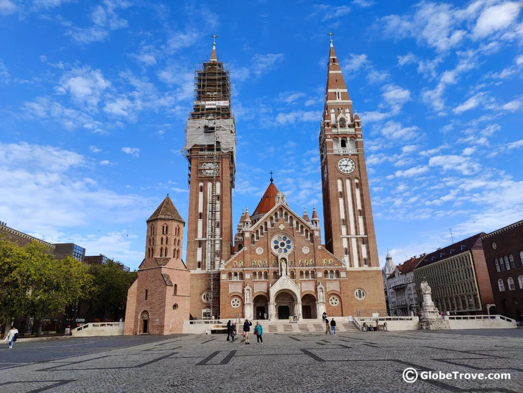 A view of the Votive church from the Dom Ter which is one of the cool places and things to do in Szeged Hungary