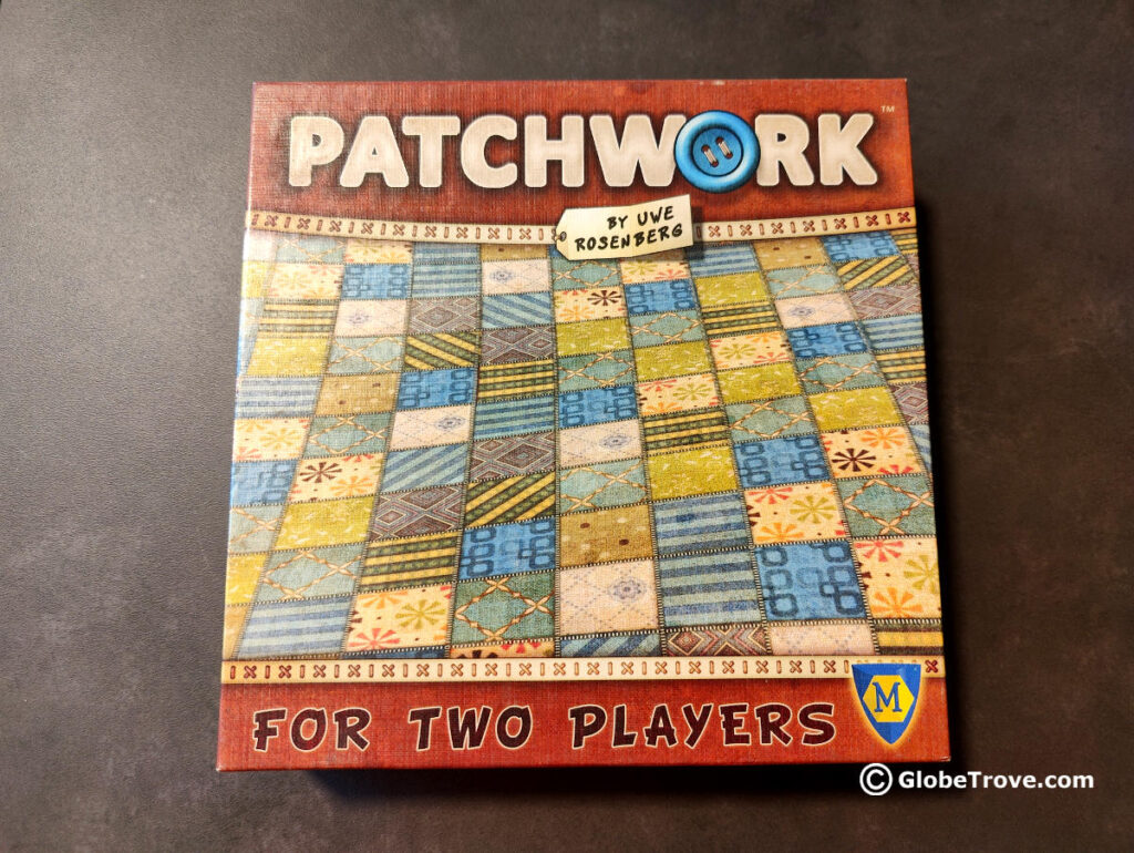 The Patchwork box by Uwe Rosenberg is really adorable and one of my favorite two player travel board games.