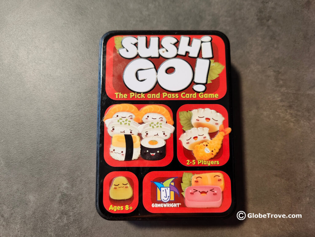 The small tin box of Sushi Go is colorful and compact. Plus its a great travel board game.