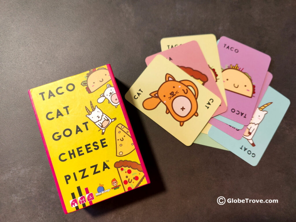 The uber cute and colorful cards of Taco Cat Goat Cheese Pizza which is one of our favorite travel board games with the kids.