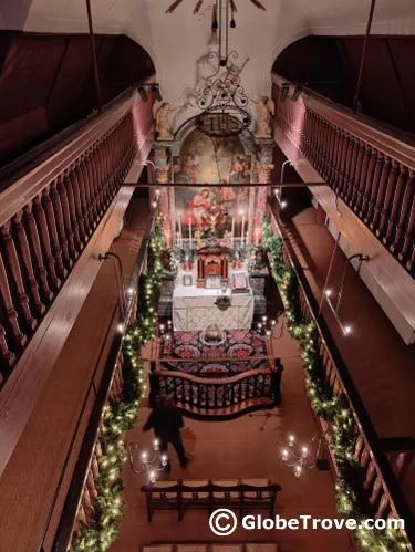 A view of the Our Lord in the Attic museum  from above and the painting below.