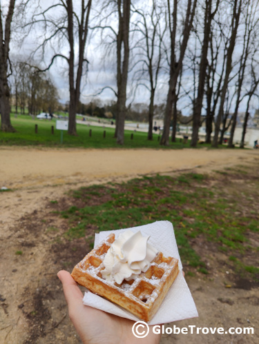 Chantilly served on top of a hot waffle on a cold winter day in the gardens of Chateau de Chantilly.
