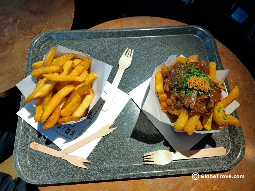 An assortment of fries from Frites Atelier one of the top places to eat in Ghent