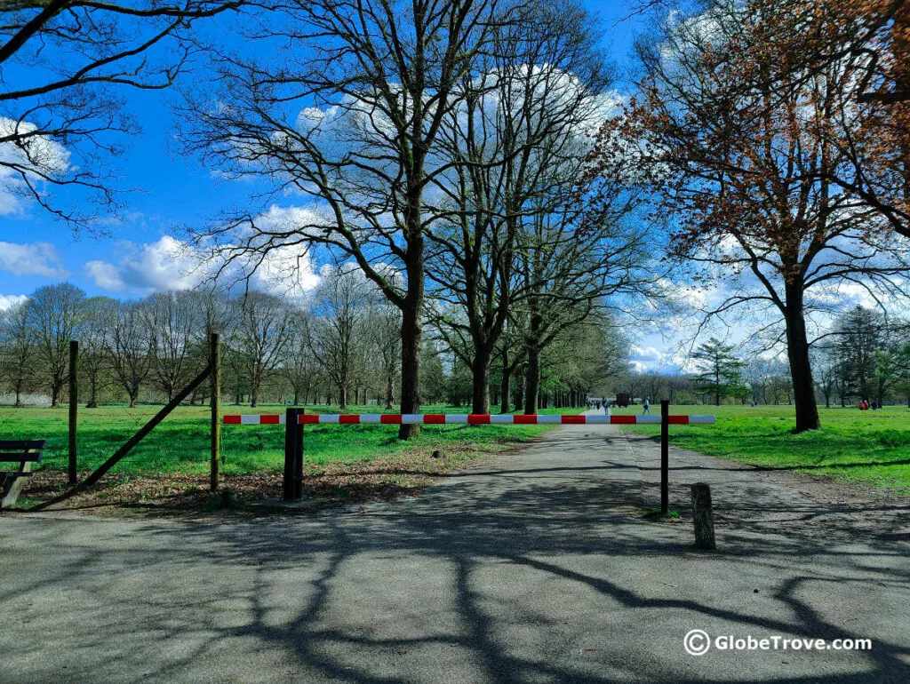 The entrance of Westerbork transit camp with the forest on one side and the barbed wire fence.