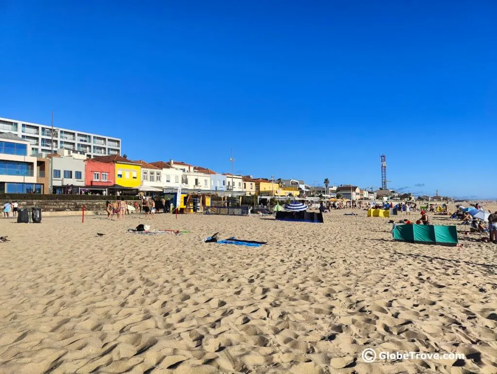 One of the many beaches in Espinho Portugal with people enjoying the sun.